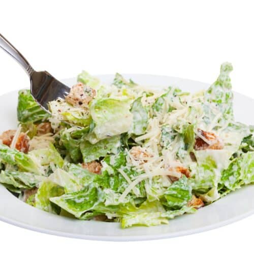 Paleo Chicken Avocado Caesar Salad Recipe On A White Plate